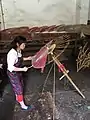 Paper parasol artisan in southern China