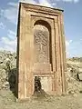 Huge khachkar monument behind Artavazik Church of the 13th century