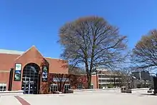 A cement plaza bordered in brick leads to the entrance to the Ferst Center for the Arts