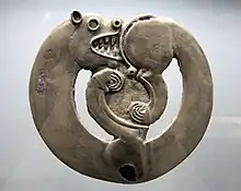 Curled-up feline animal from Arzhan-1, circa 800 BCE.