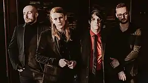 As It Is during a photoshoot for The Great Depression in 2018. From left to right: Patrick Foley, Benjamin Langford-Biss, Patty Walters, and Alistair Testo.