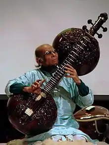 Ustad Asad Ali Khan playing the Rudra veena in traditional style