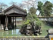 Pleasure garden in the residence of the imperial queen-mother. Hòn non bộ is installed in the lake