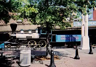 Six Gun Territory No. 4, a 4-4-0 steam locomotive on display at the entrance of the revamped Underground