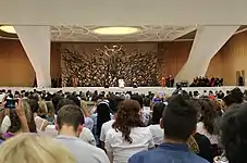 Pope Francis on the stage of the audience hall in 2014