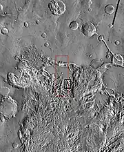 THEMIS image of wide view of following HiRISE images.  Black box shows approximate location of HiRISE images.  This image is just a part of the vast area known as Aureum Chaos.