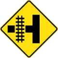 (W7-12) Railway Level Crossing on Side Road (left)