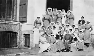 Nursing staff of the Australian Voluntary Hospital. Matron Ida Greaves is at the front, fourth from the left