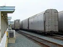 Autoracks are lined up on the right.