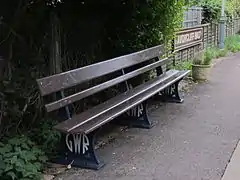 Preserved GWR seat and old station sign