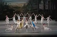 Victor Baranov as the god Apollo, Eugenia Obratzova as the goddess Flora and Maxim Chaschegorov as the god Zephyr with the corps de ballet in the Mariinsky Ballet's reconstruction of Le Réveil de Flore. St. Petersburg, 2007