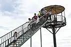 People getting off a watchtower
