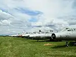 Outdoor exposition of aircraft, various MiG-21 fighters