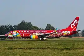 A Boeing 737-800 (B-1750) in Lianyungang - Flower and Fruit Hill livery.
