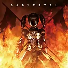 A girl with pigtails wearing a suit of armor also obscuring her face. Flames surround her and the background, and two flags stand behind her crossed in an "X" shape. The word "BABYMETAL" appears above in white font.