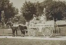 White horse-drawn fire engine