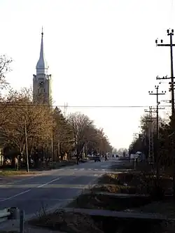 Main street with Catholic church in Bačko Gradište