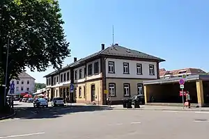 Wide two-story building with hipped roof