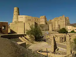 Walls of a stone fort and a tower.