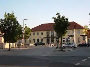 Wide two-story building with hip roof