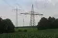 Crossing of single phase AC powerline Fulda-Gemünden ( tower on the right) with single phase AC powerline Flieden-Bebra ( tower on the left)