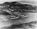 Balboa harbor on 25 October 1934. Fleet moored include two battleships at dock, three cruisers, tenders Whitney and Dobbin, with more than 40 destroyers, noted are McFarland, Goff, and Long