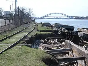 Tracks on the North Shore Branch eroding into the [[Kill Van Kull]]