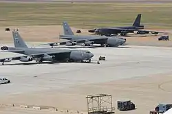 Three Boeing B-52H Stratofortress bombers sit on the flight-line at Barksdale Air Force Base in 2012.
