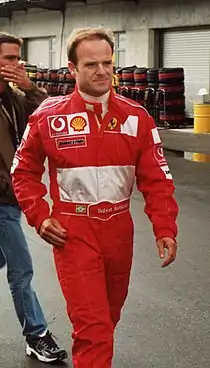 Photograph of Rubens Barrichello in a red racing suit