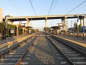 Barrio Logan station with part of the San Diego–Coronado Bridge in the background, 2018