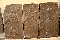 Basalt wall slab showing Assyrian soldiers in procession, holding long spears. From the palace of Tiglath-pileser III at Arslan Tash, Syria. Ancient Orient Museum, Istanbul