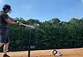Baseball bat uses a charge to launch a baseball