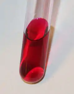 A sample of fuchsine dye in an aqueous solution