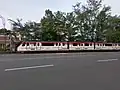 Batara Kresna railbus running along Jalan Slamet Riyadi in the middle of Surakarta City.