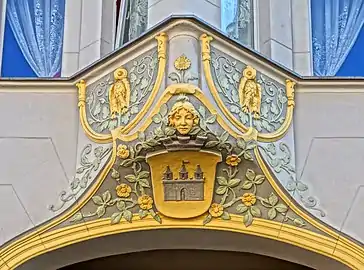 Bay window ornament with a woman head and Bydgoszcz coat of arms