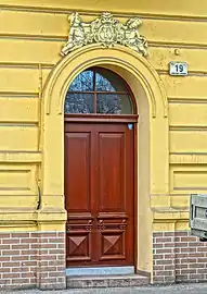 Street entrance with K initial of the first landlord