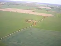 Aerial view of Beacon Hill farm, showing the route of Mareham Way through the fields.  This aerial view is somewhat washed out because it was photographed through the side window of a light aircraft.
