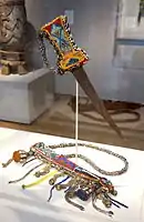 Beaded sword and Sheath, Nigeria, Yoruba people; beads, metal, fabric, coins, brass, cowry shells, leather - Chazen Museum of Art
