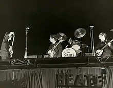 The Beatles performing at the Gator Bowl in 1964.