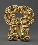 Belt buckle with paired felines attacking ibexes, derived from earlier Scythian art. Ordos, 3rd century BC. Usually described as Xiongnu despite early date.