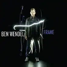 Ben Wendel posing in front of plain black background