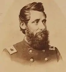 Sepia print shows a bearded man in a dark military uniform with a double row of buttons.