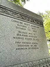 A large grave marker reading: Caroline Scott Harrison; October 1, 1832; October 25, 1892; Beloved Wife of Benjamin Harrison; Married October 20, 1853; First President General; Daughters of the American Revolution
