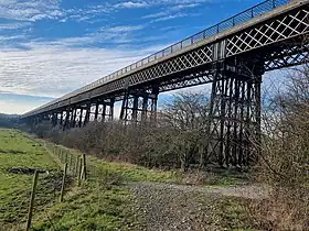 long metal bridge in a flat valley