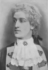 young white man, clean shaven, in 18th centur costume and white wig