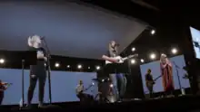 A band performing on stage