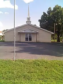 A white brick building in Bethel.