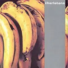 A bunch of bananas with a grey strip going down the right-hand side