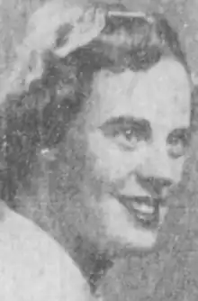 A smiling young white woman, from a 1955 newspaper