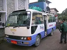 Small bus with luggage on top